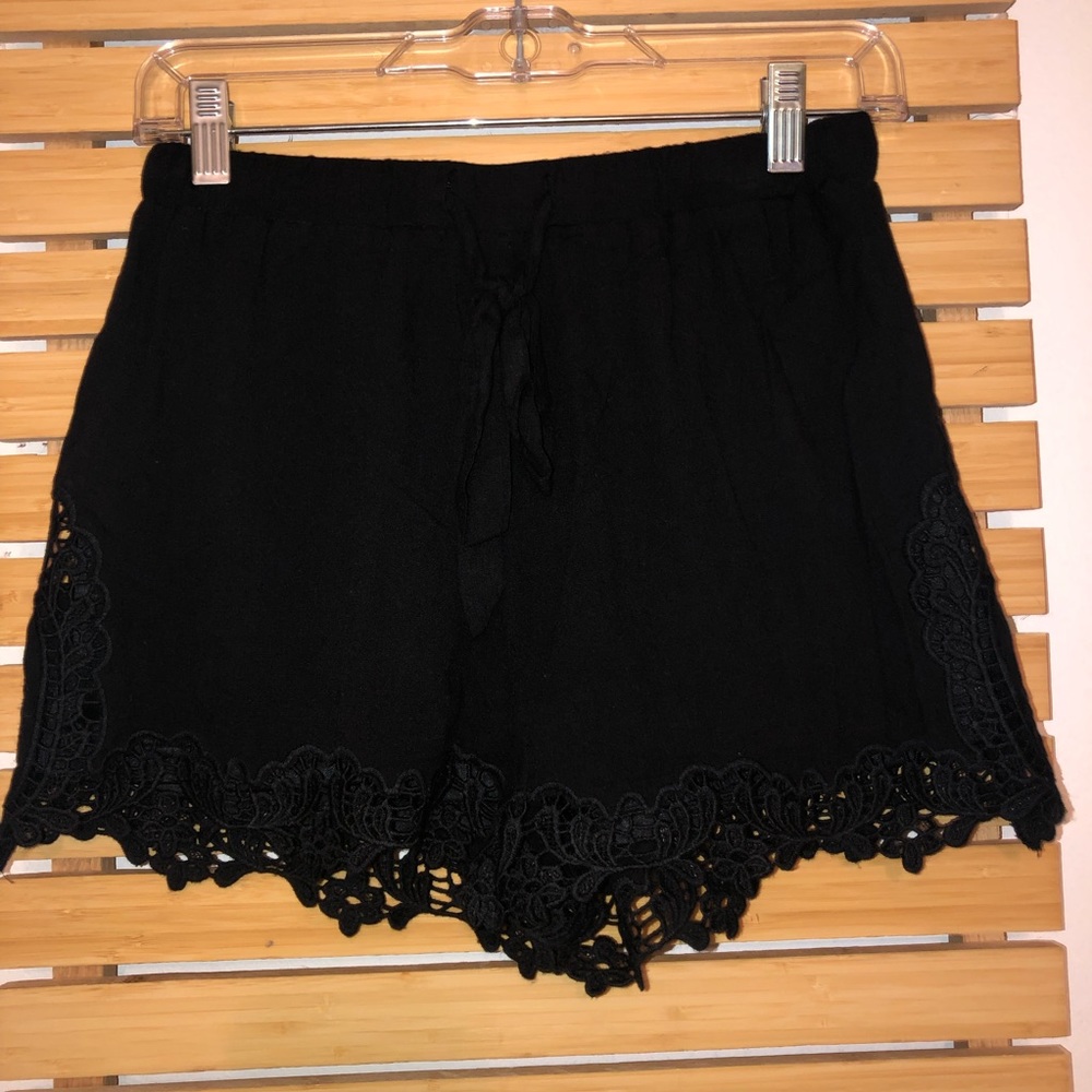 black intricate shorts.